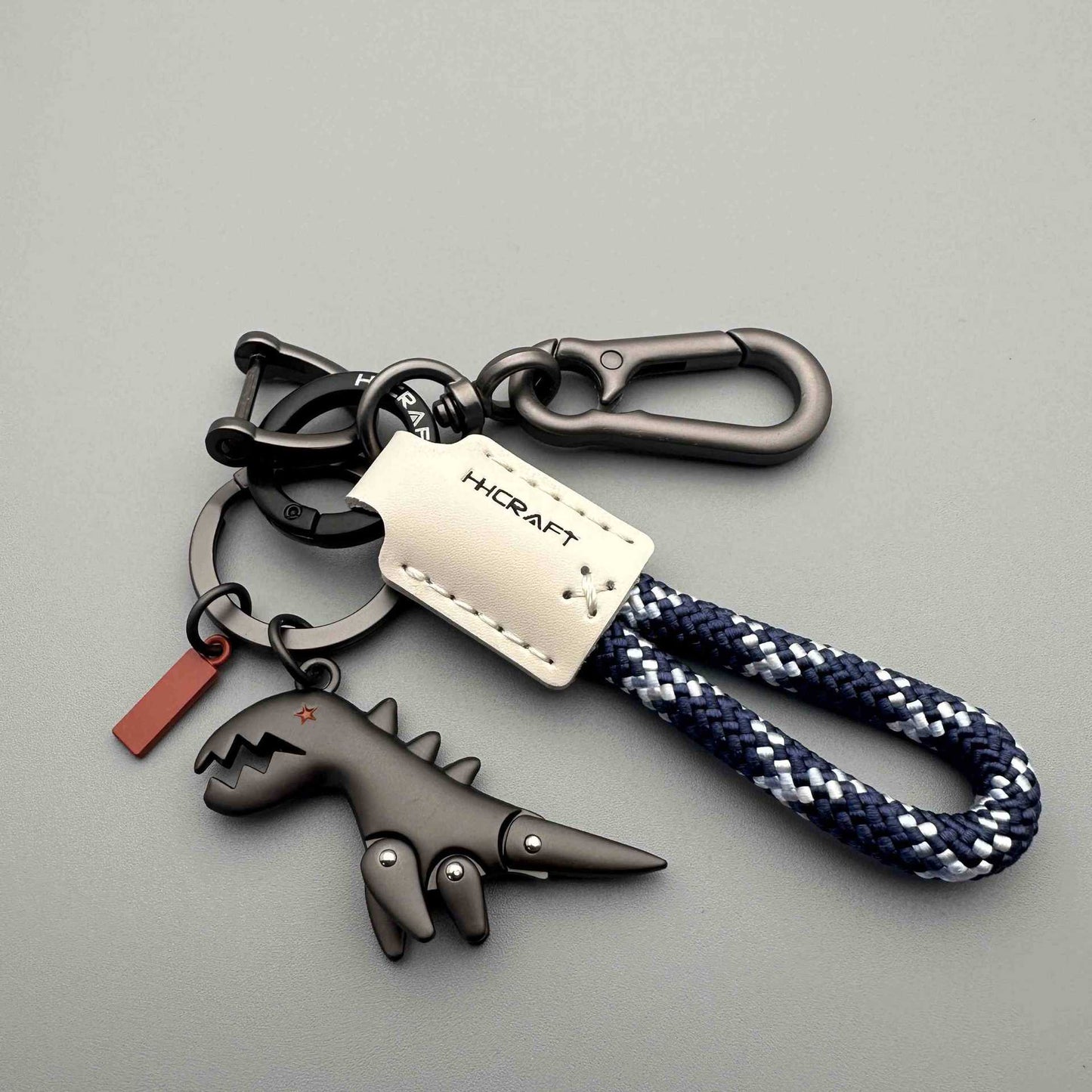 Aluminum Alloy Dinosaur Charm Paired with a Hand-woven Braceletš„